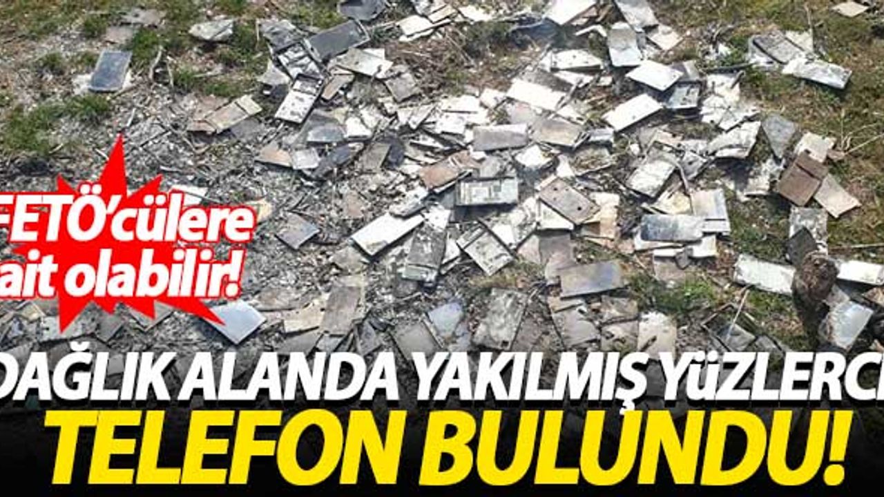 Dağlık alanda yakılmış yüzlerce telefon bulundu
